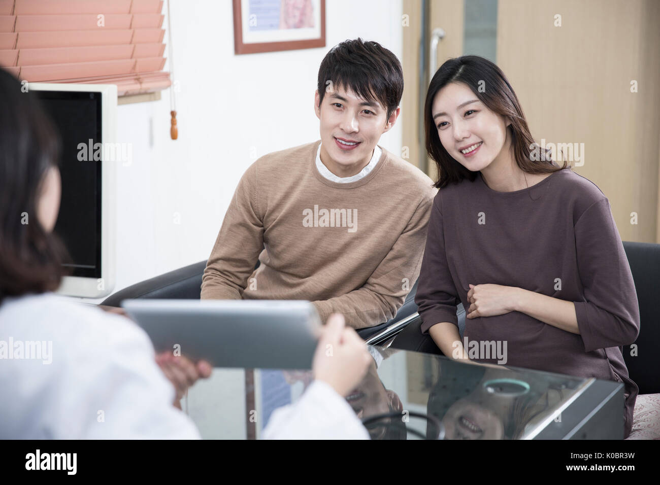 Smiling asian doctor hi-res stock photography and images - Alamy
