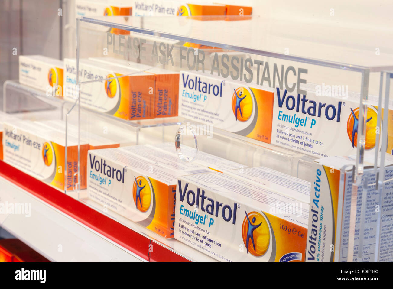 Voltarol products on sale in a chemist shop,pharmacy shelf,pharmacists,drug store Stock Photo