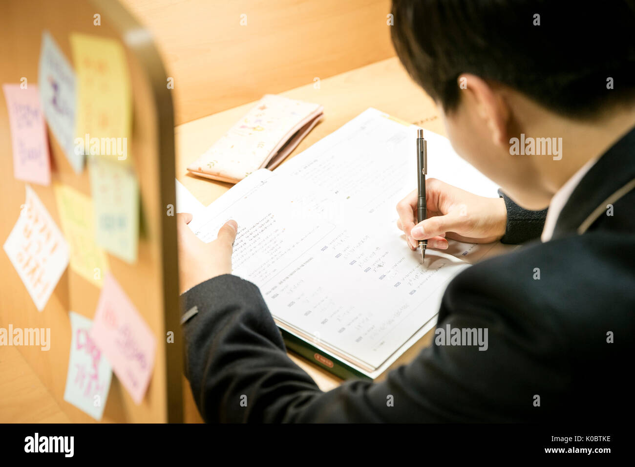 Side view portrait of school boy studying hard Stock Photo