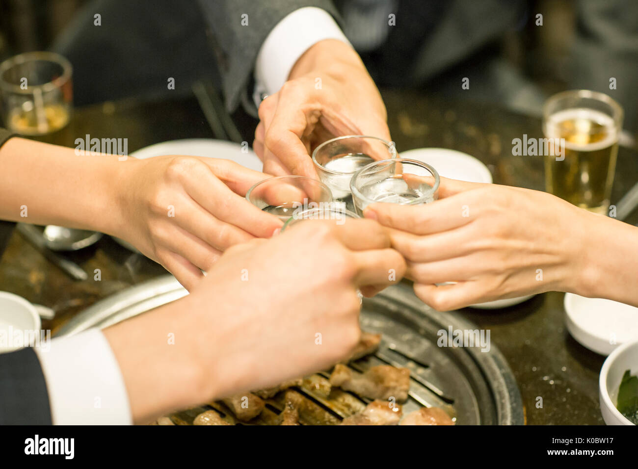 Coworkers toasting at get-together Stock Photo