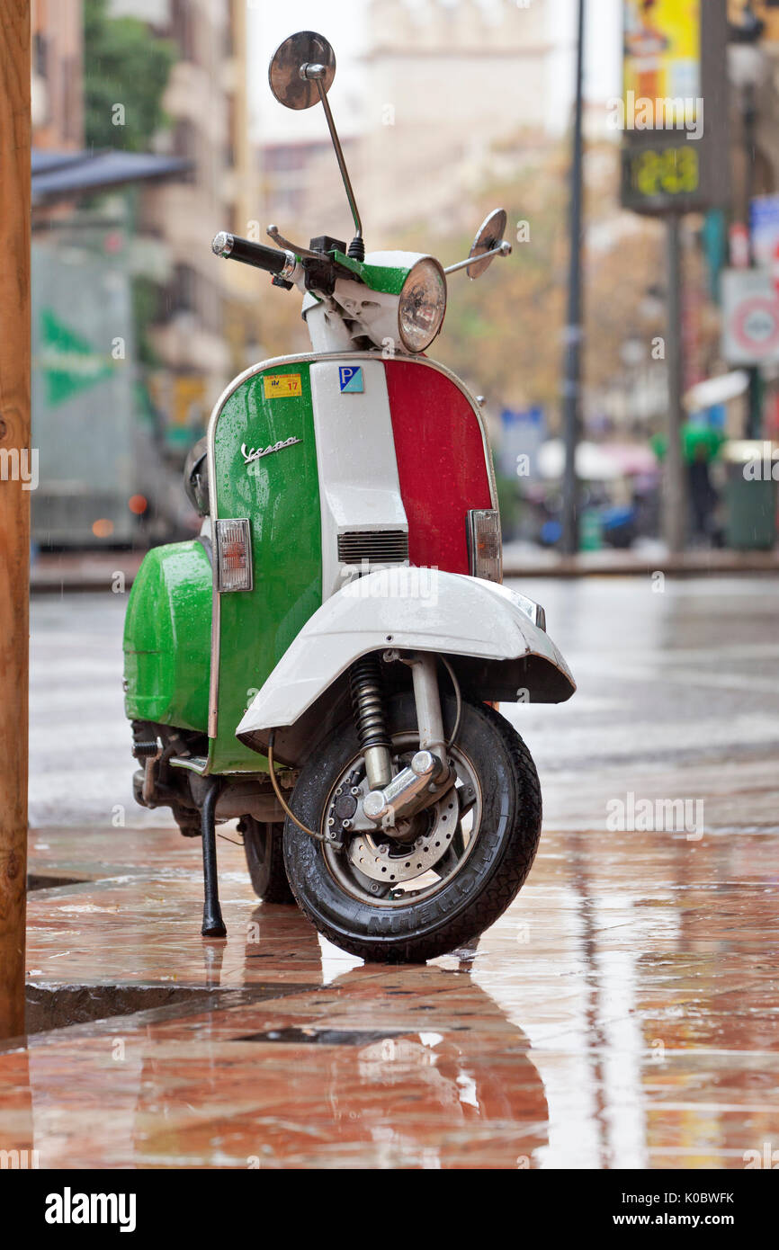 Vespa scooter in the colours of the italian flag Stock Photo - Alamy