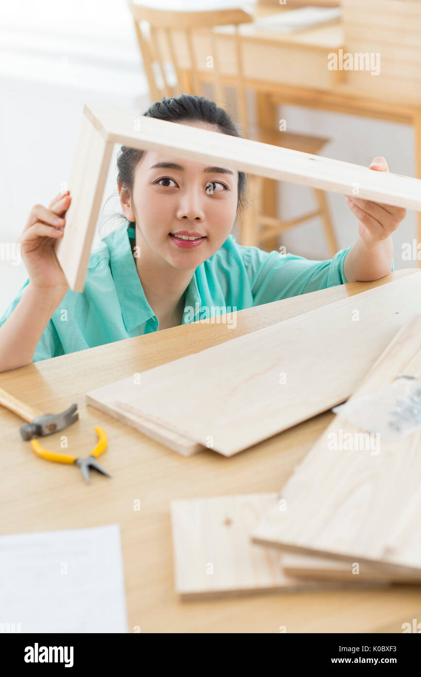 Single woman enjoying woodworking Stock Photo Alamy