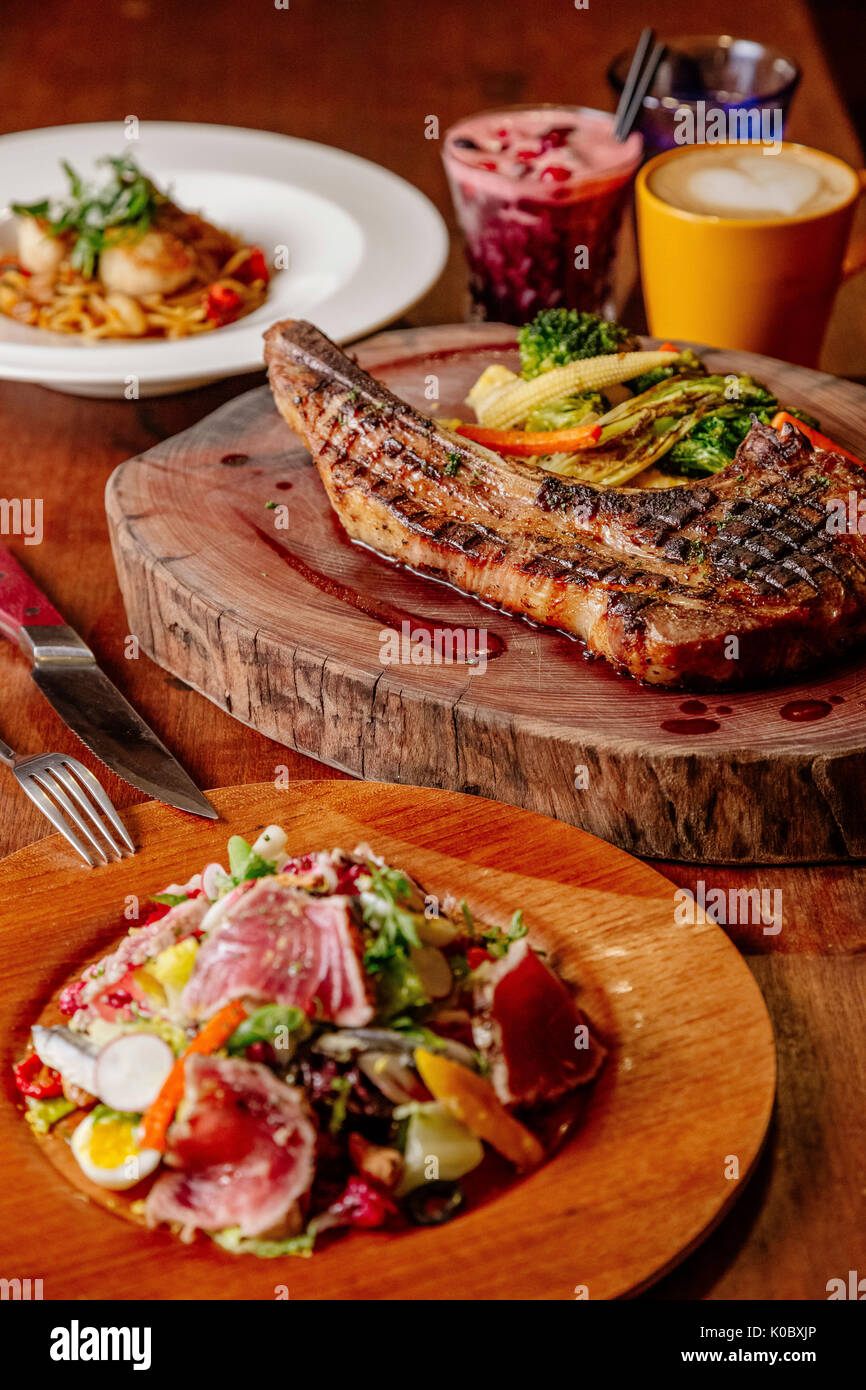 Tuna Nicoise Salad and pork steak Stock Photo Alamy