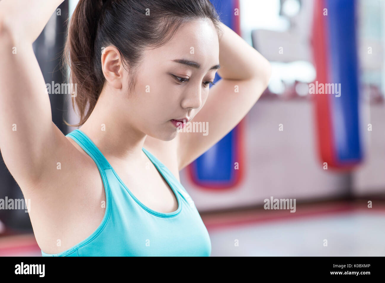 Side view portrait of young woman in sportswear Stock Photo