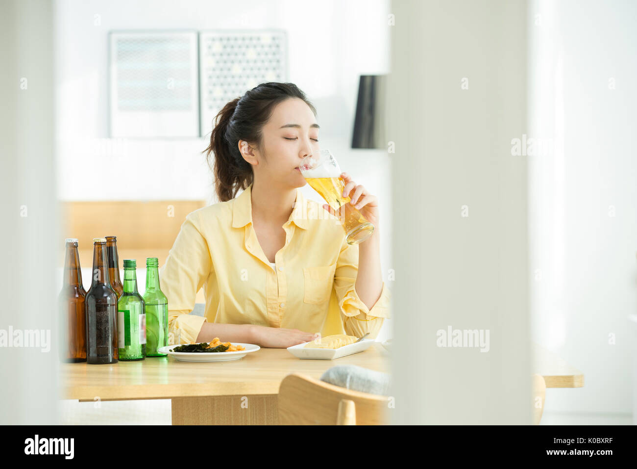 Portrait of single woman drinking alone Stock Photo