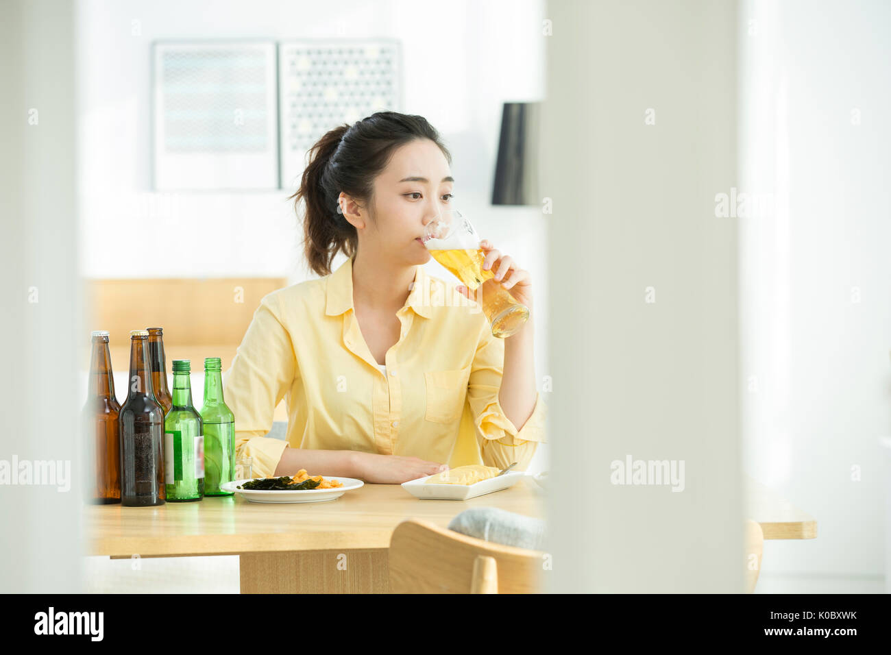 Portrait of single woman drinking alone Stock Photo