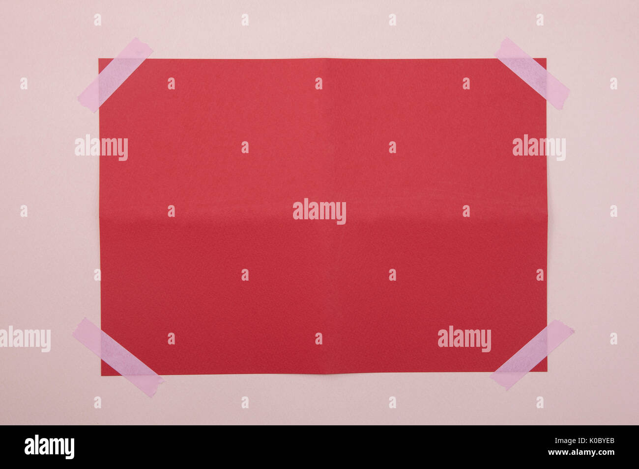 Frame with attached red paper Stock Photo - Alamy