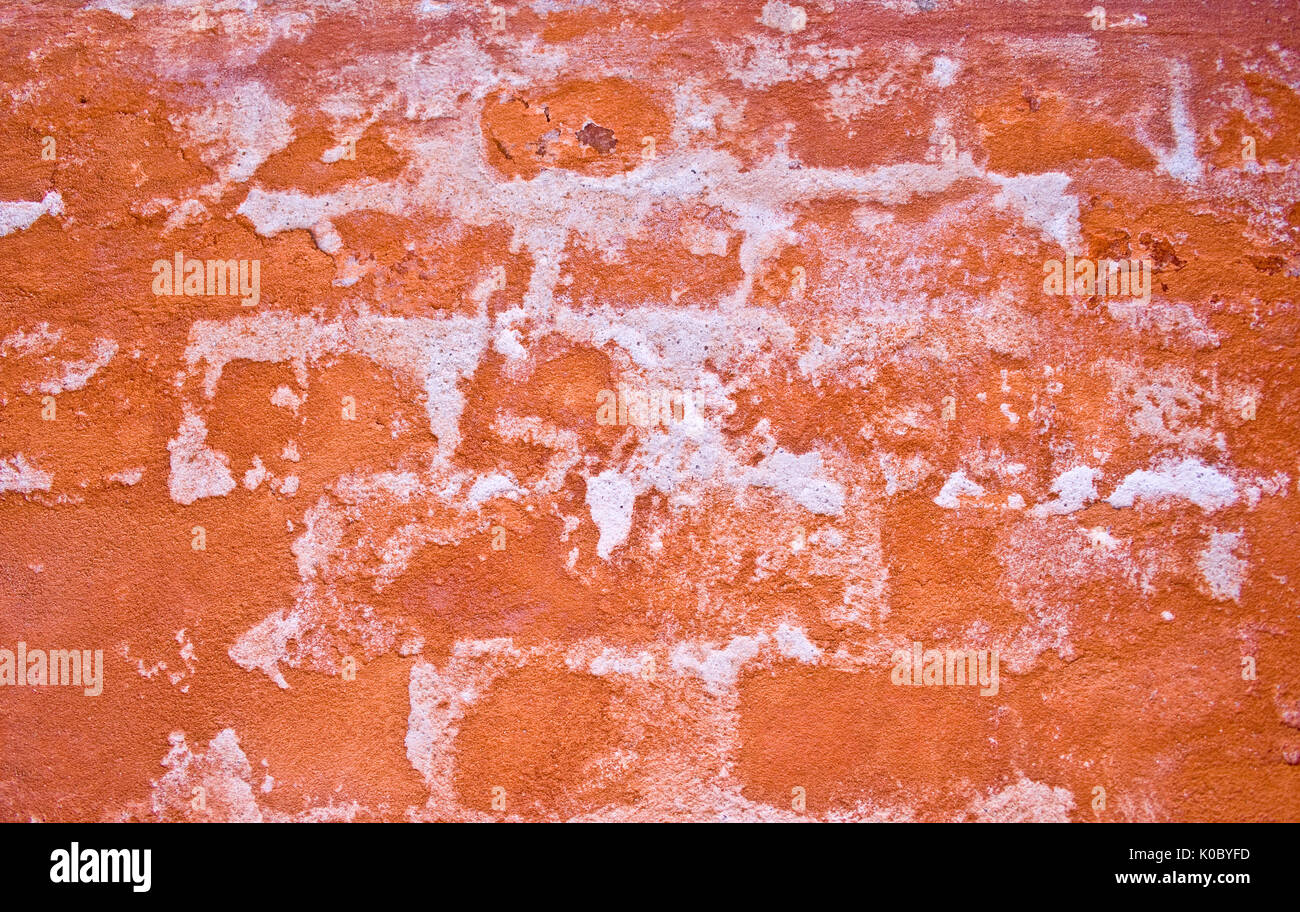 abstract image of with crumbling paint and underlying bricks showing