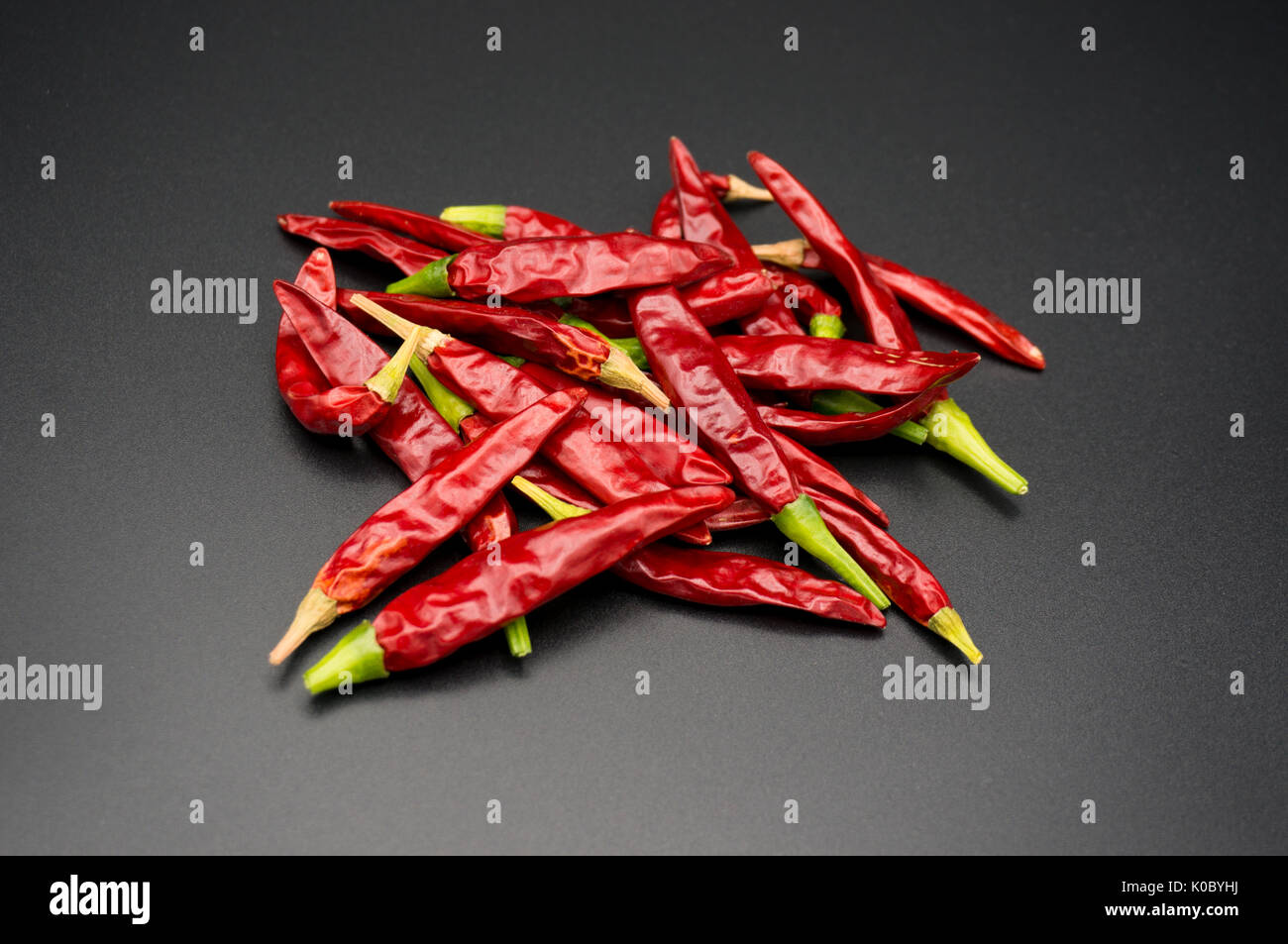 Pile of many sun dried red chillies on black background Stock Photo Alamy