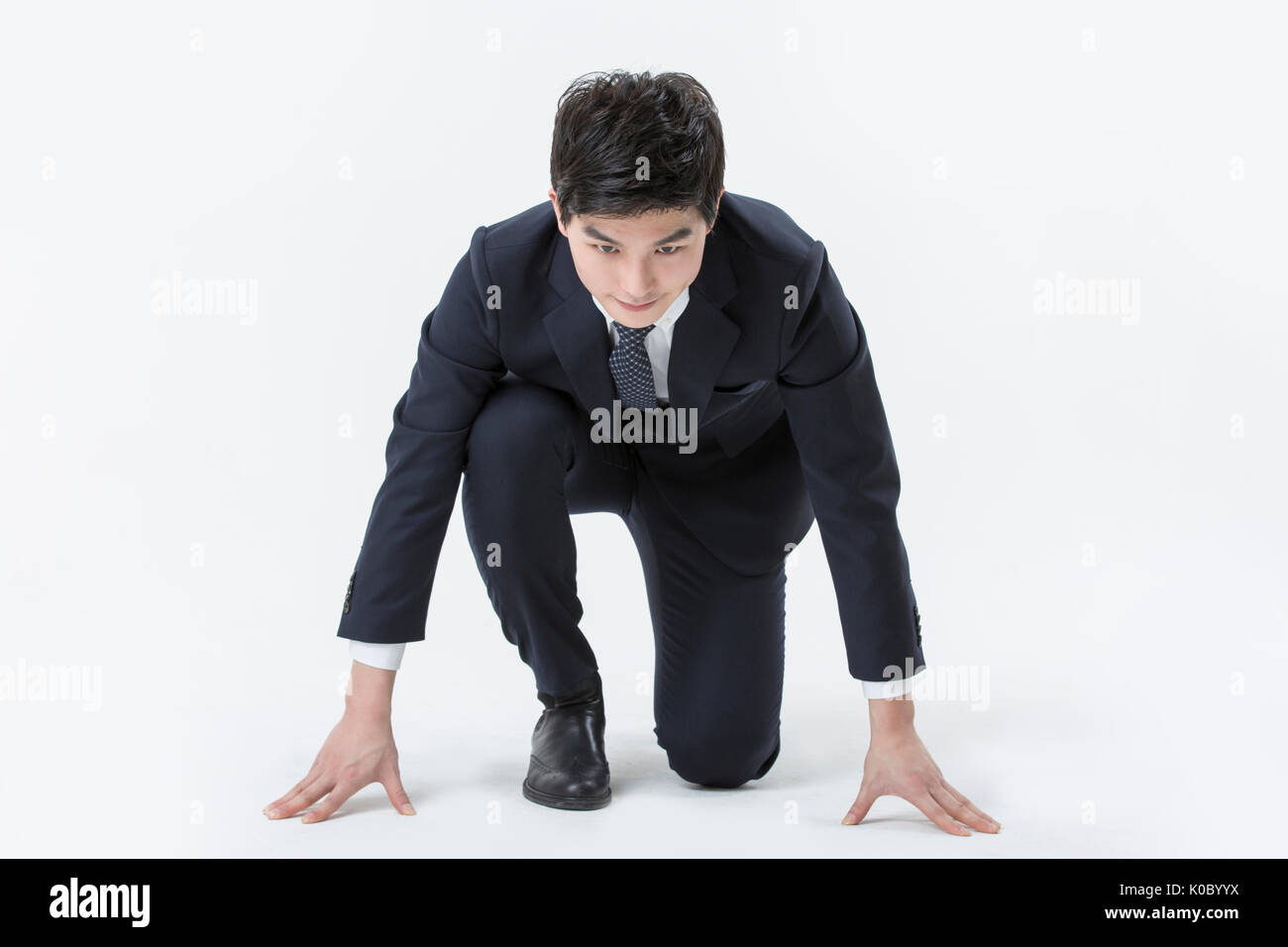 Man kneeling suit hi-res stock photography and images - Alamy