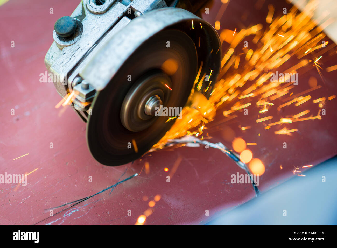 metal sawing with grinder close up Stock Photo Alamy