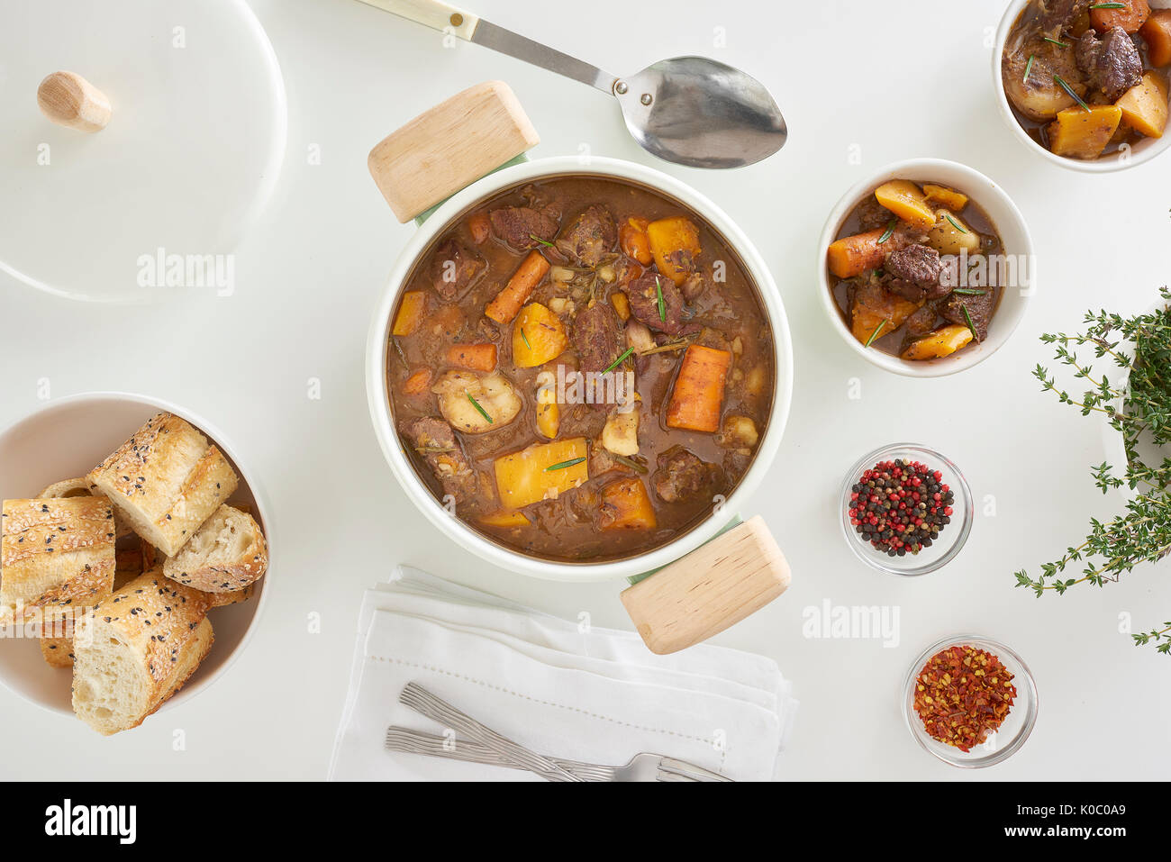 A pot of hearty beef stew with carrots, onions and squash. Stock Photo