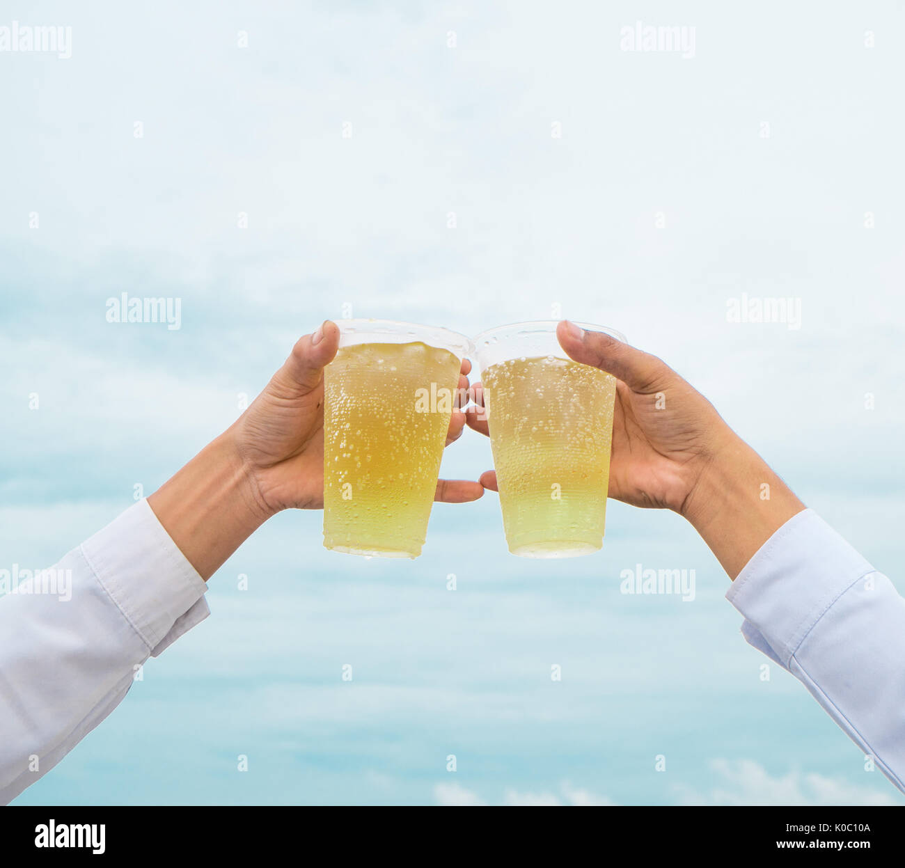 Hands hold beers hi-res stock photography and images - Alamy