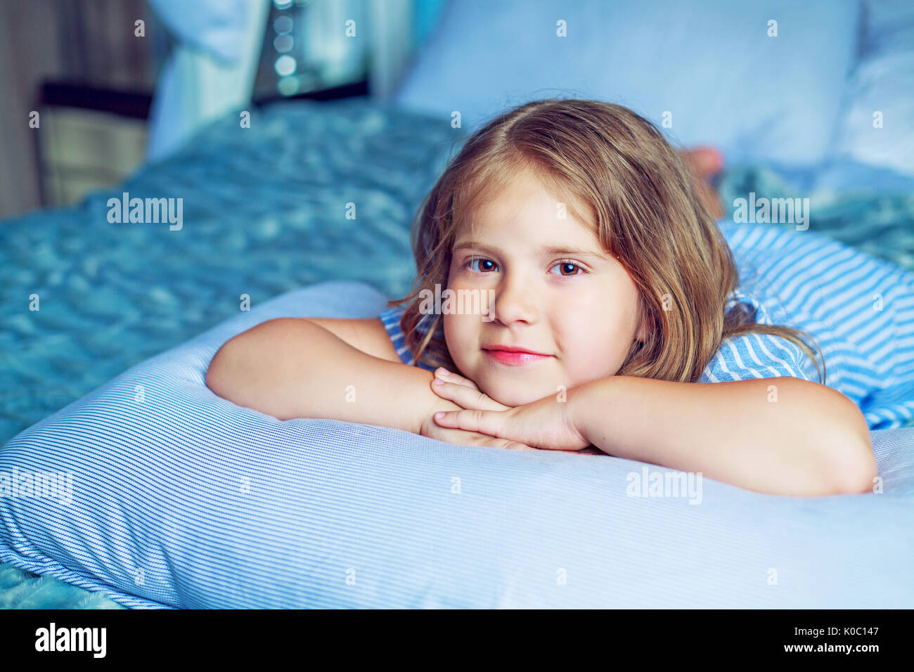 happy girl in bed at home Stock Photo Alamy