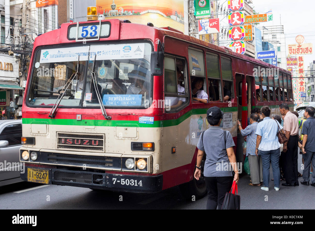 People catching a bus in Chinatown, Bangkok, Thailand Stock Photo