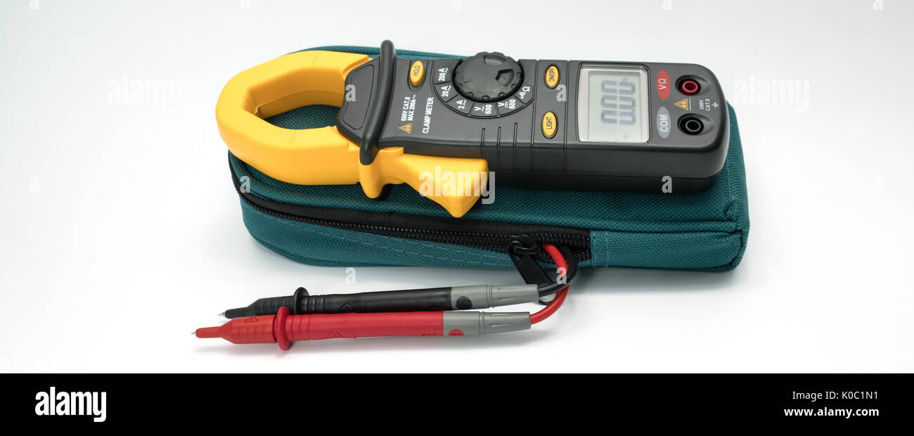 Digital clamp meter with probes on white background with copy space Stock Photo