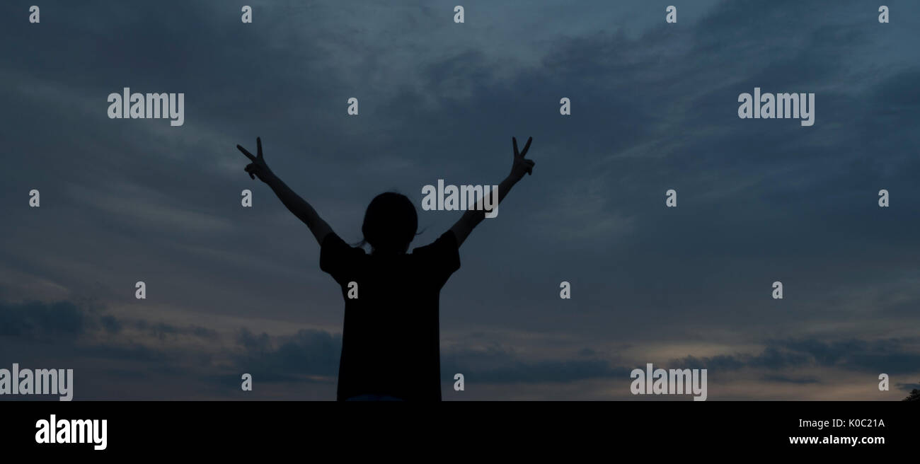 Silhouette woman open arms hi-res stock photography and images - Alamy
