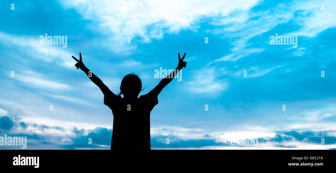 Woman silhouette standing open hands hi-res stock photography and ...