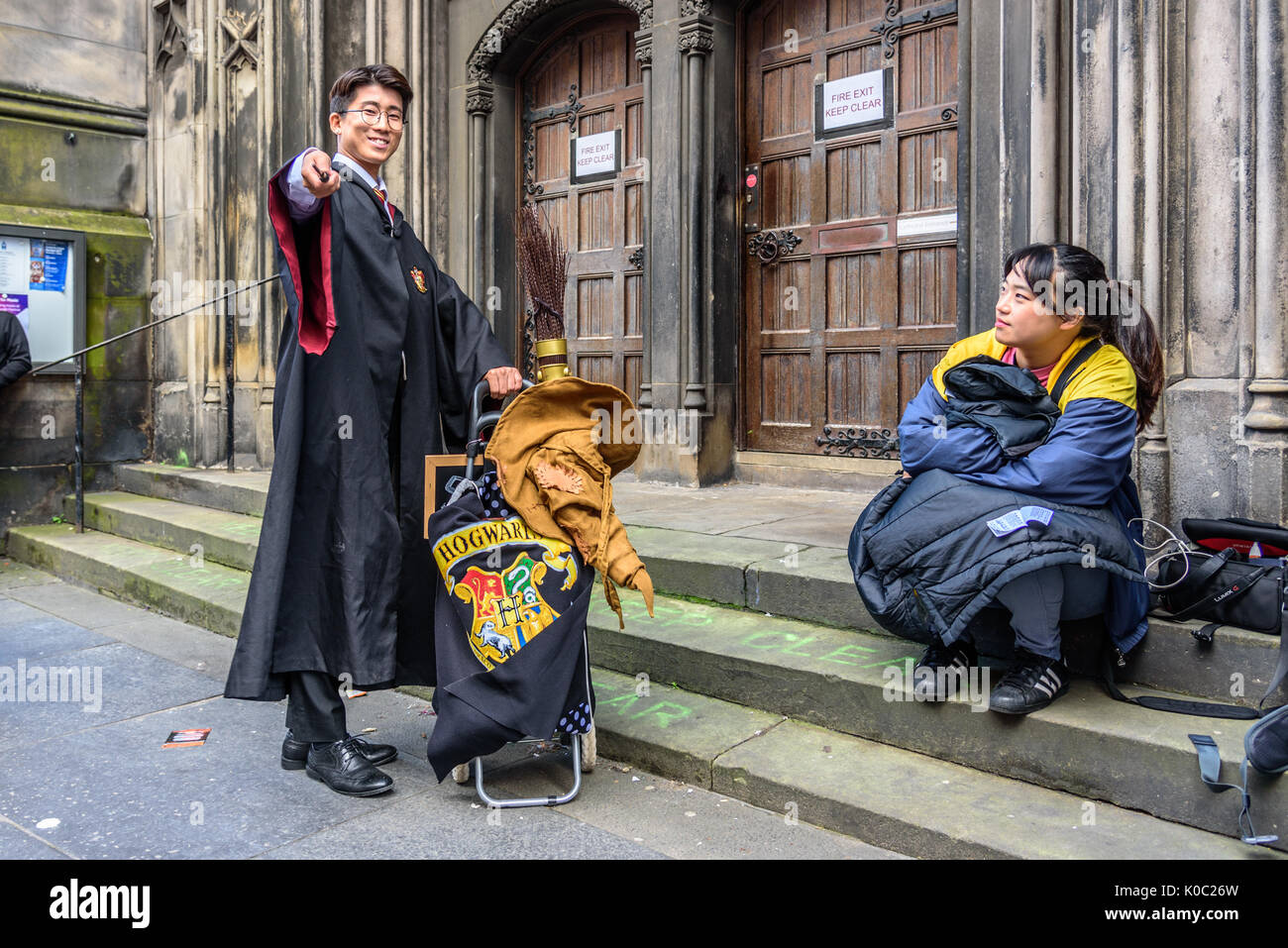 EDINBURGH, UNITED KINGDOM - AUGUST 15, 2017 - An asian boy disguised in Harry Potter along the Royal Mile of Edinburgh during the 70th anniversary of  Stock Photo