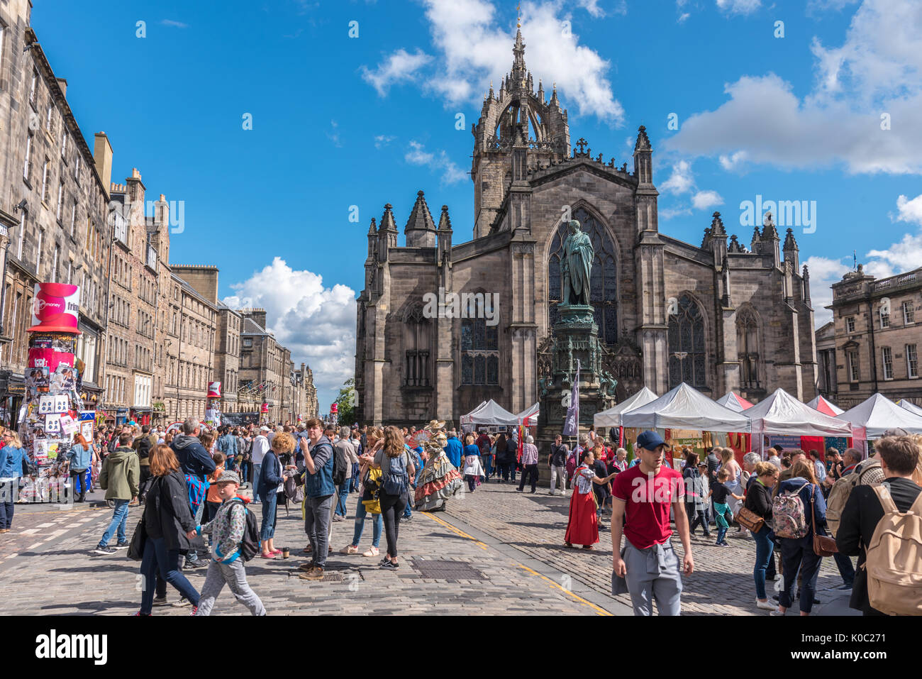 EDINBURGH, UNITED KINGDOM - AUGUST 15, 2017 - A boy advertises a theatrical performance along the Royal Mile of Edinburgh during the 70th anniversary  Stock Photo