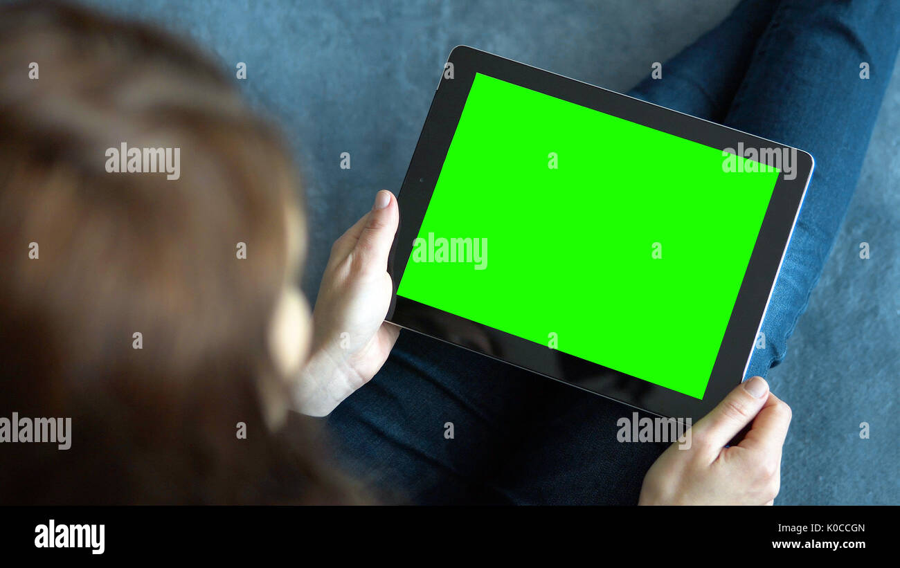 Girl Holding Tablet PC on Blue Stock Photo