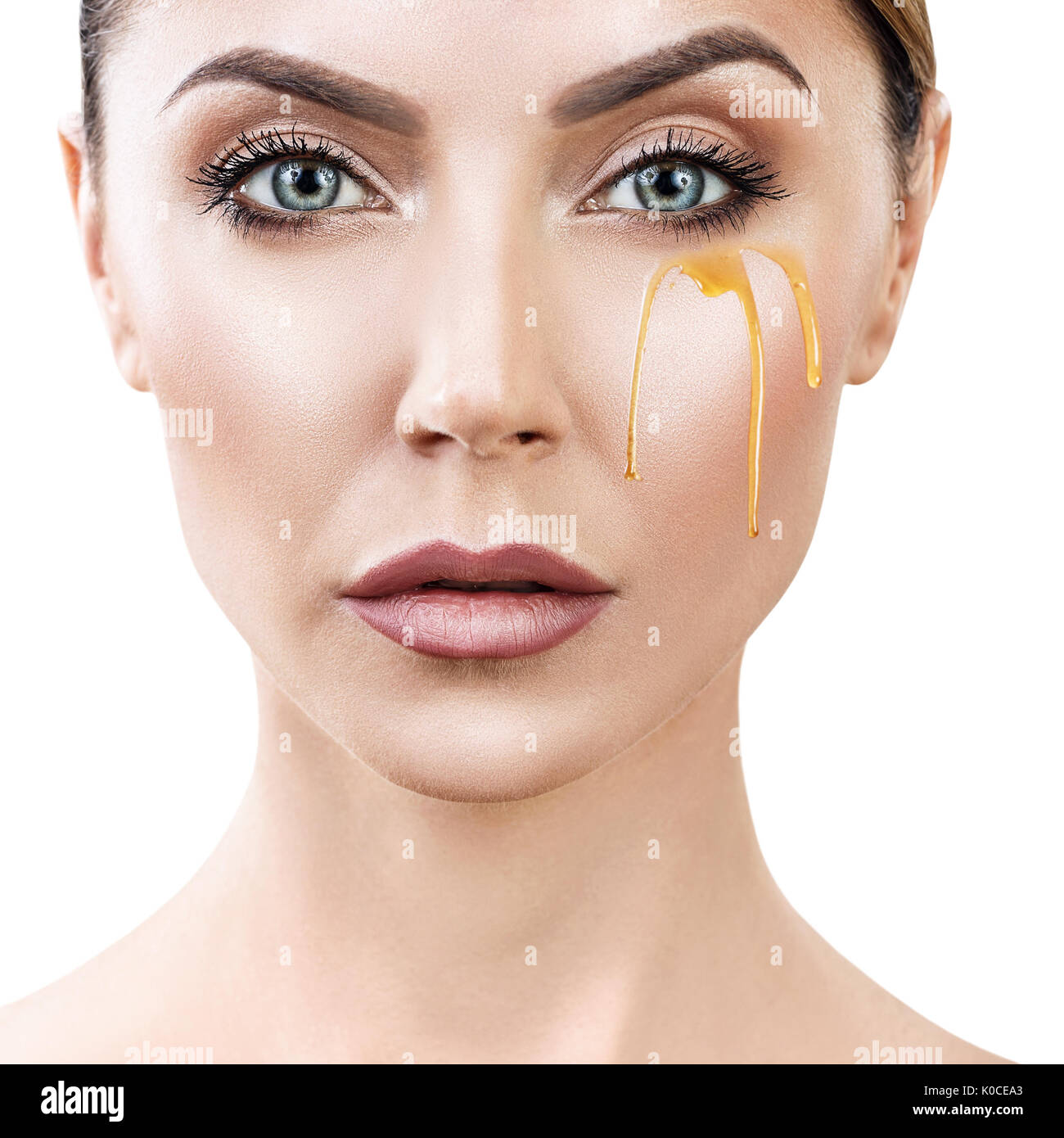 Beautiful woman with honey on face Stock Photo Alamy