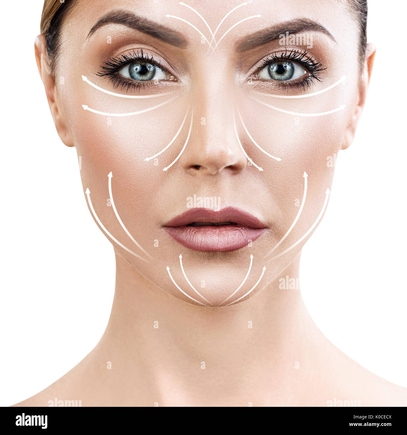 Beautiful woman face with massaging arrows on face Stock Photo