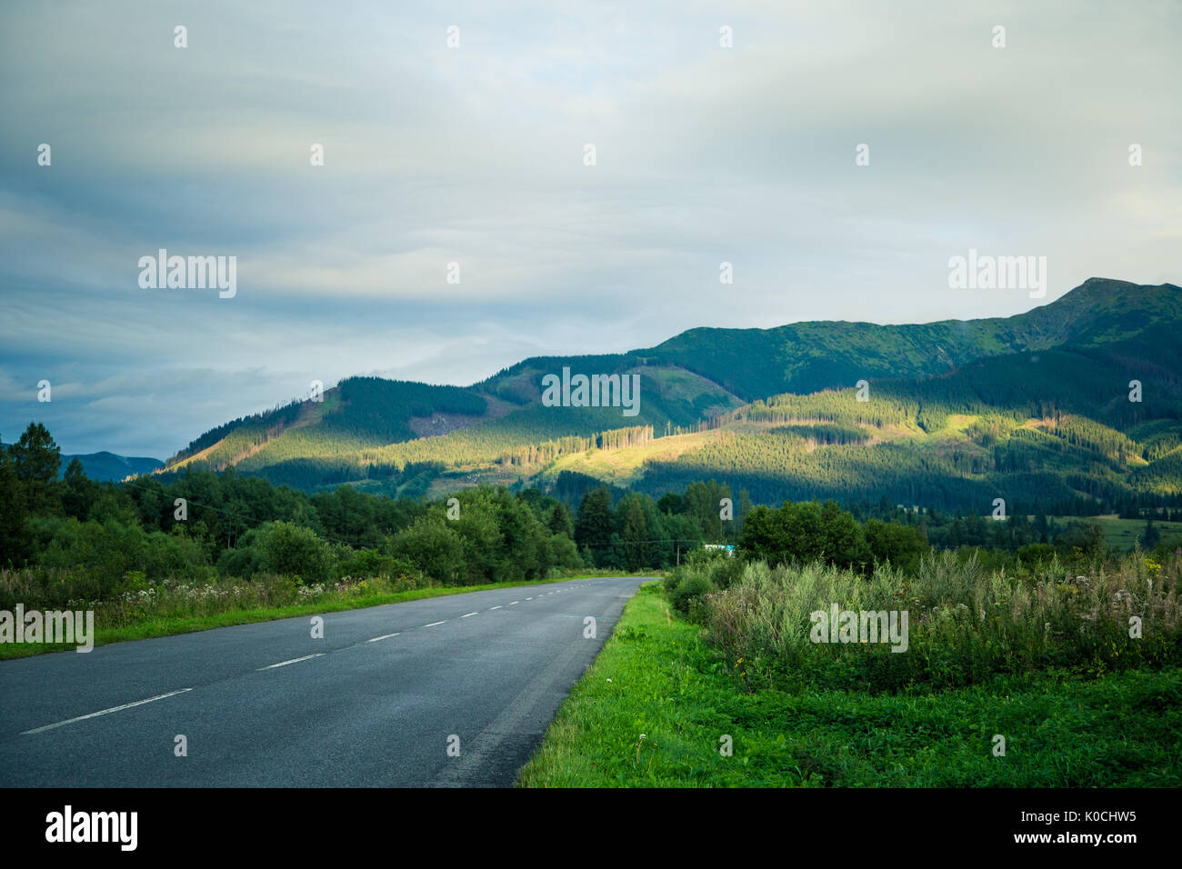 A beautiful mountain landscape with a road Stock Photo - Alamy