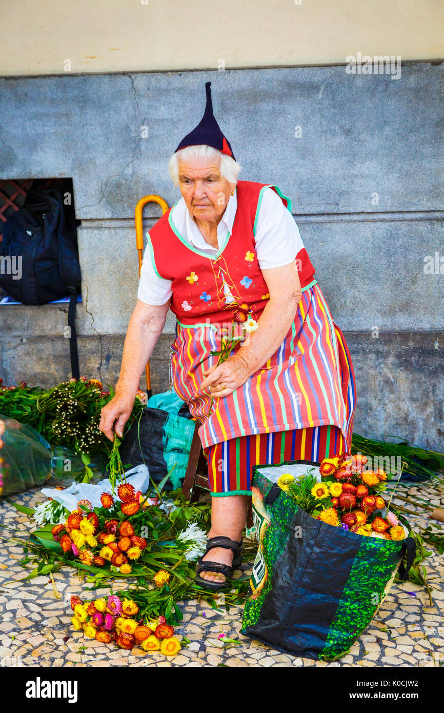 Woman selling flowers. Stock Photo