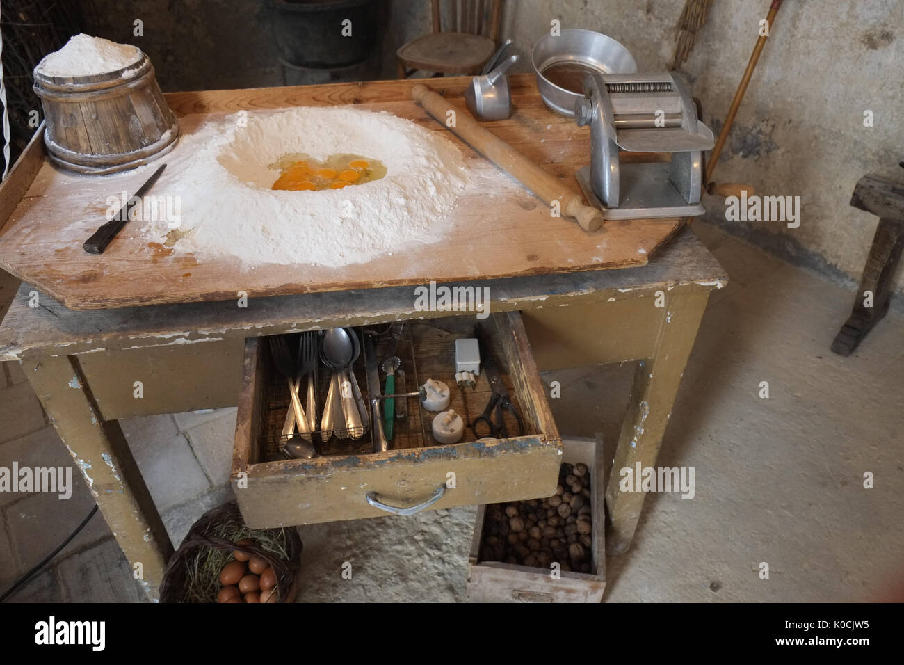 Italian old kitchen pasta preparation with raw ingredients. Eggs and flour. The Walk of Brigands follows the ancient Italy borderlin Stock Photo