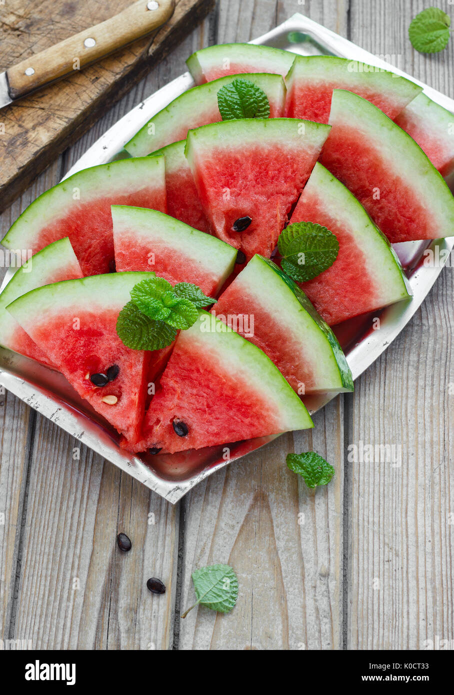Fresh Sliced Watermelon In A Metal Bowl Wooden Background Stock Photo fresh-sliced-watermelon-in-a-metal-bowl-wooden-background-stock-photo