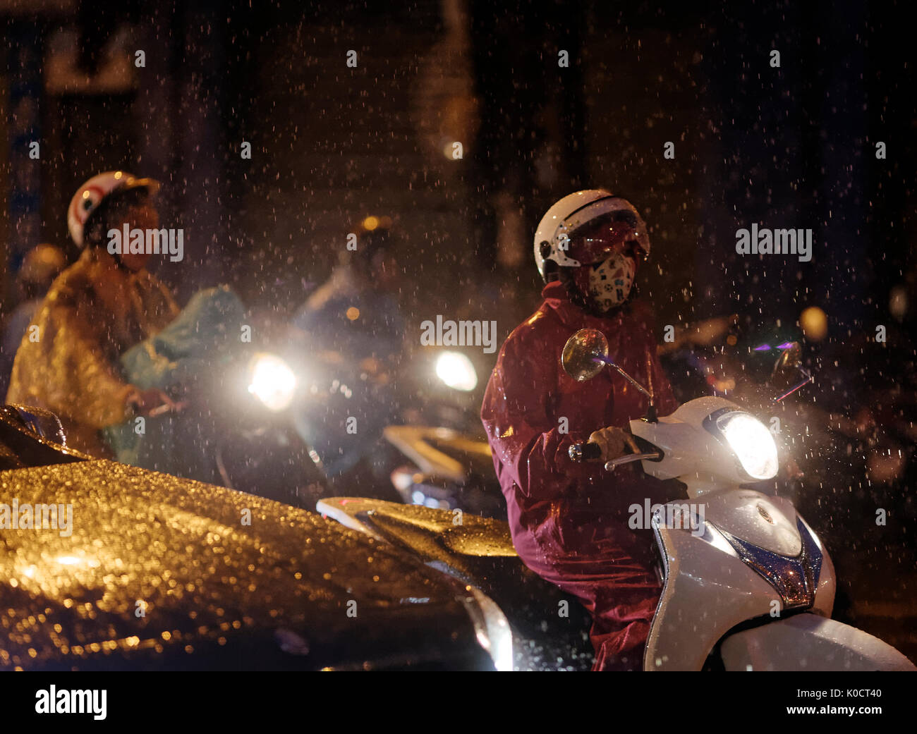 Hanoi Mopeds in Rain Stock Photo Alamy