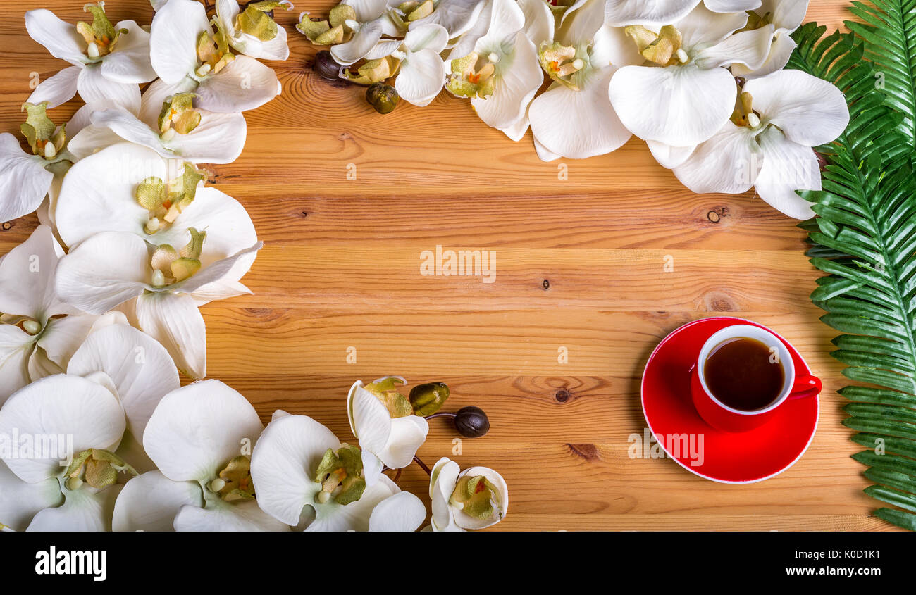 Poster layout with empty frame, orchid and cup of coffee Stock Photo