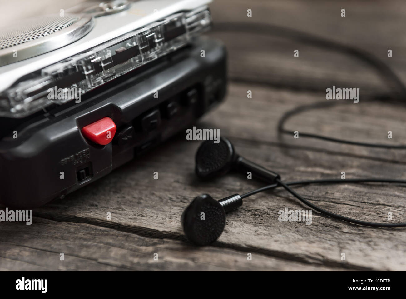 Vintage walkman cassette player with earbuds and tape cassette, retro