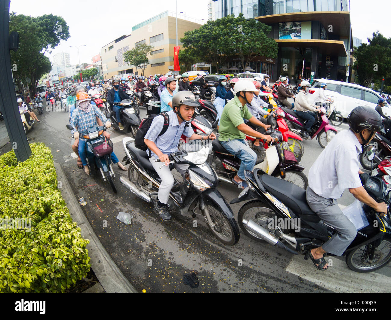 HO CHI MINH CITY, VIETNAM - JULY 25, 2017: Road traffic in Saigon, Vietnam. In the biggest city in Southern Vietnam are more than 4 mil. motorbikes, t Stock Photo