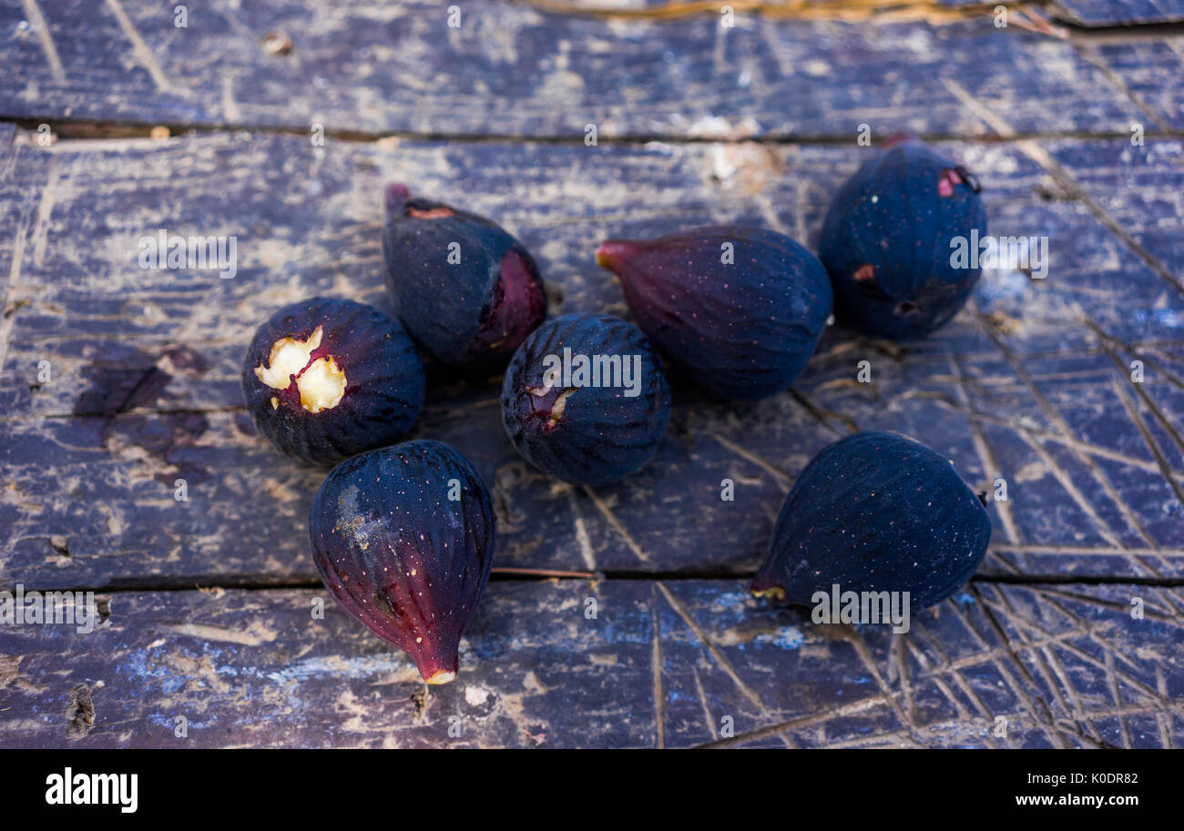 black figs on a wooden table Stock Photo