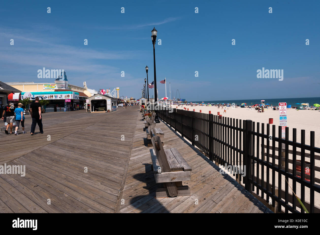 Seaside Heights, NJ USA -- August 21, 2017 -- People are walking along the Seaside Heights boardwalk. Editorial Use Only. Stock Photo