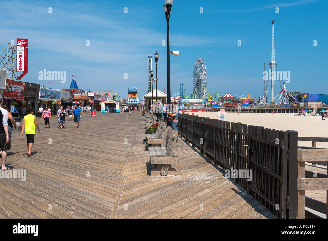 Seaside Heights, NJ USA -- August 21, 2017 -- People are walking along the Seaside Heights boardwalk on a hot summer day. Editorial Use Only. Stock Photo
