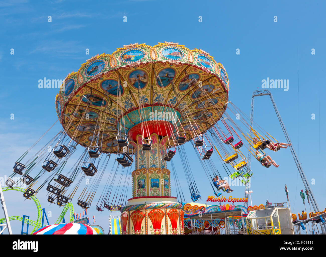 Seaside Heights, NJ USA -- August 21, 2017 -- People riding the Wave Swinger at the Seaside Heights amusement park. Editorial Use Only. Stock Photo