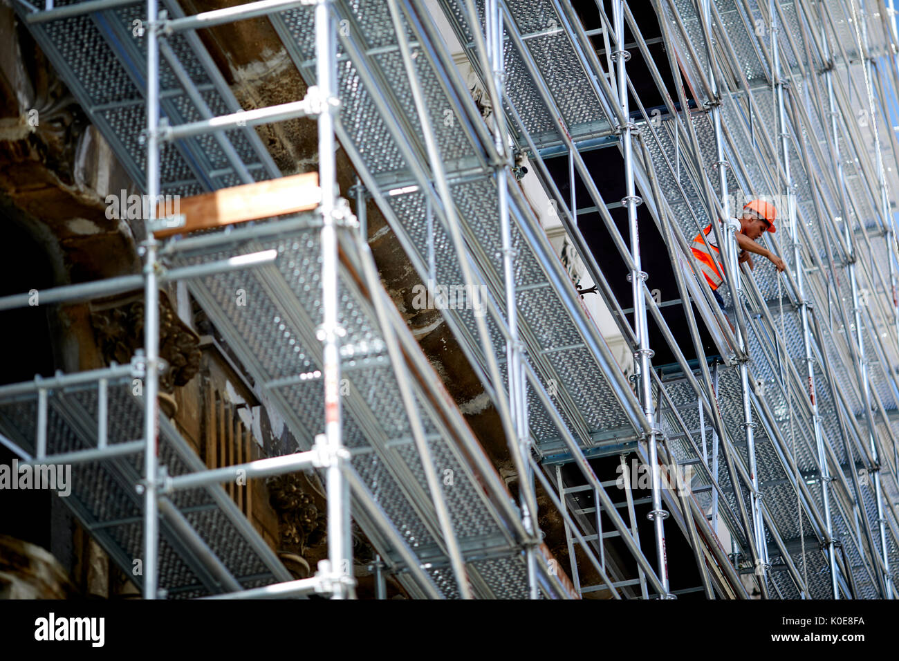 Capital Havana in Cuba, Cuban workman on metal scaffolding Stock Photo