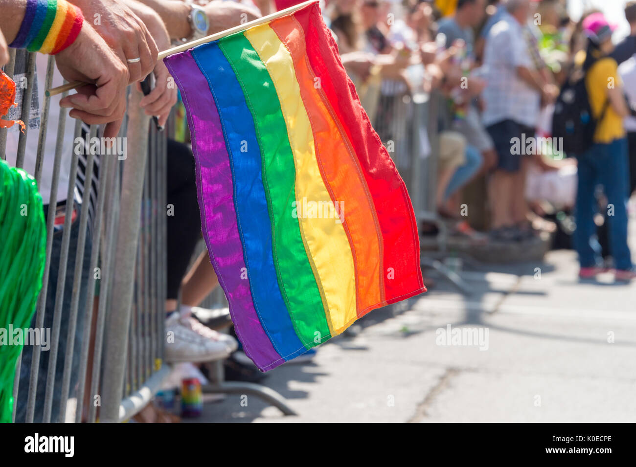 Montreal, CANADA - 20 August 2017: Gay rainbow flag at Montreal gay pride parade with blurred spectators in the background Stock Photo