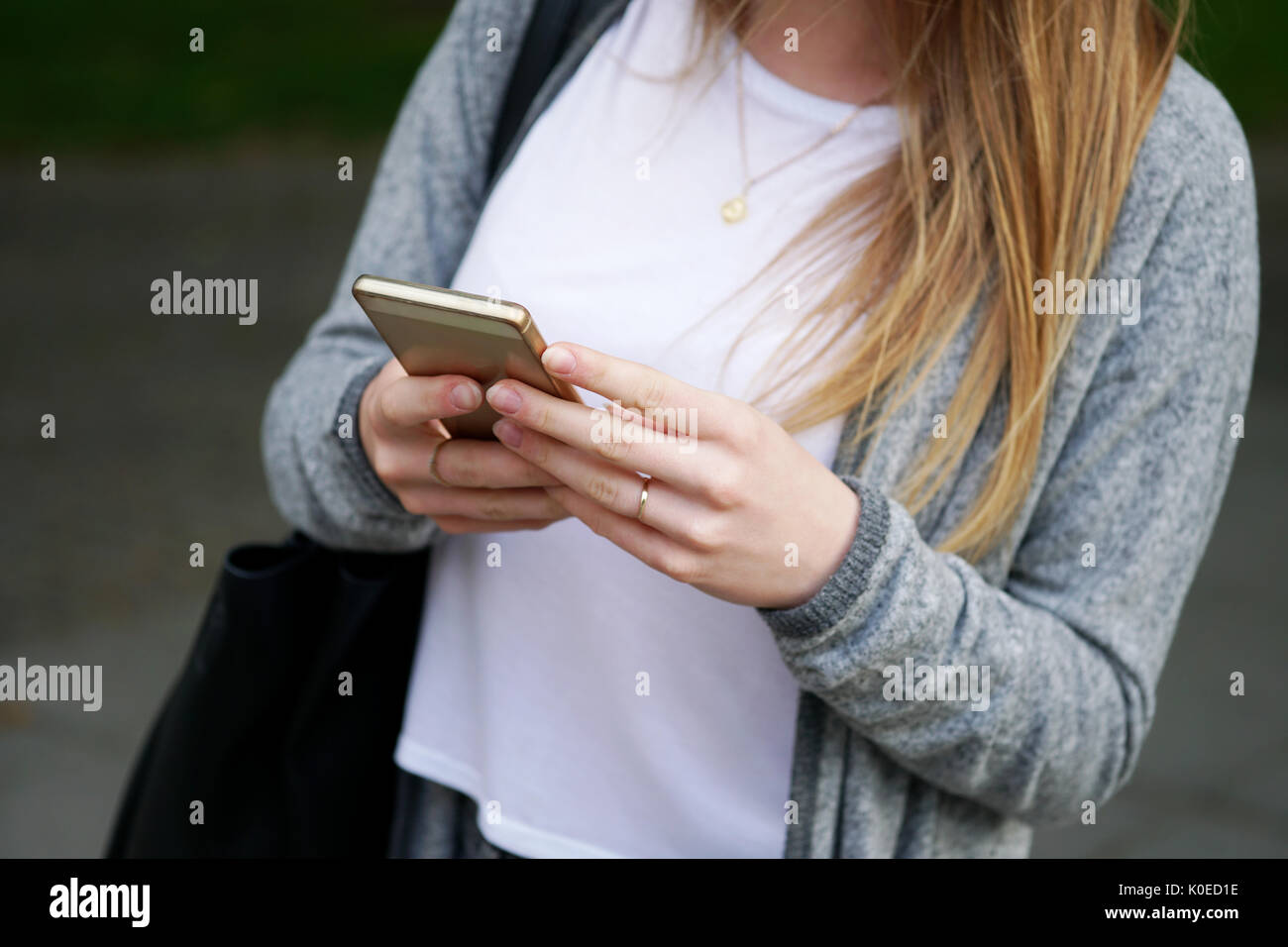 young woman using smartphone Stock Photo