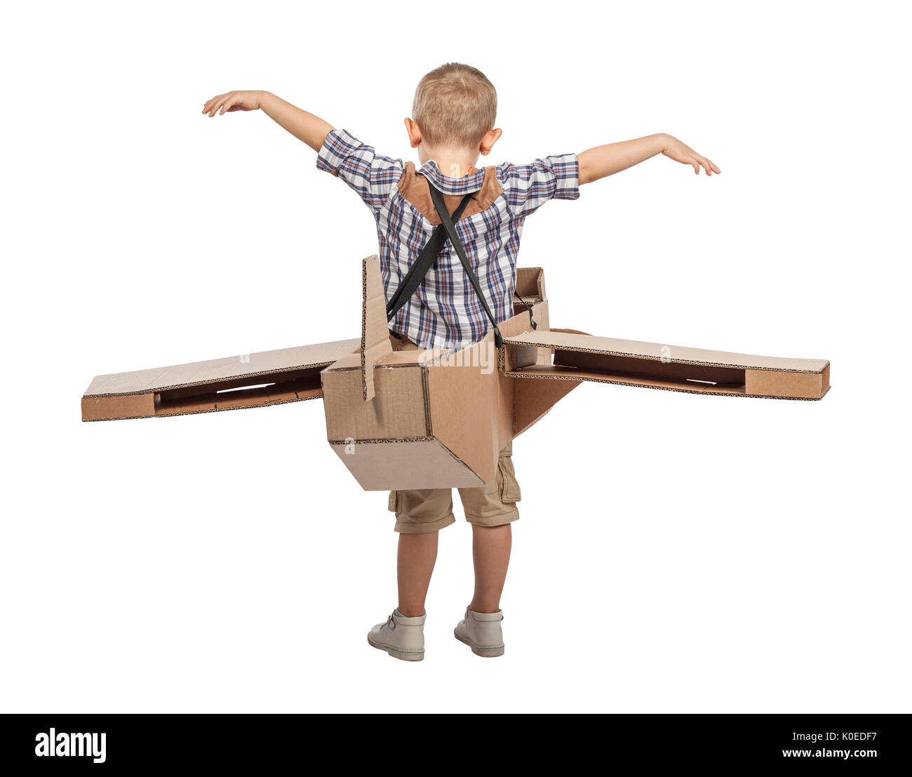 caucasian child play with cardboard airplane isolated on white background Stock Photo