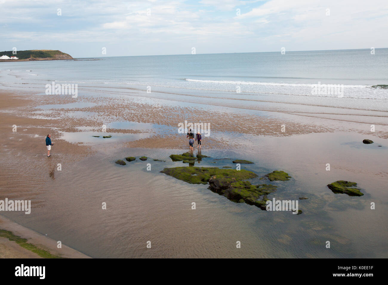 Family rock pooling at North Bay Beach, Scarborough Stock Photo