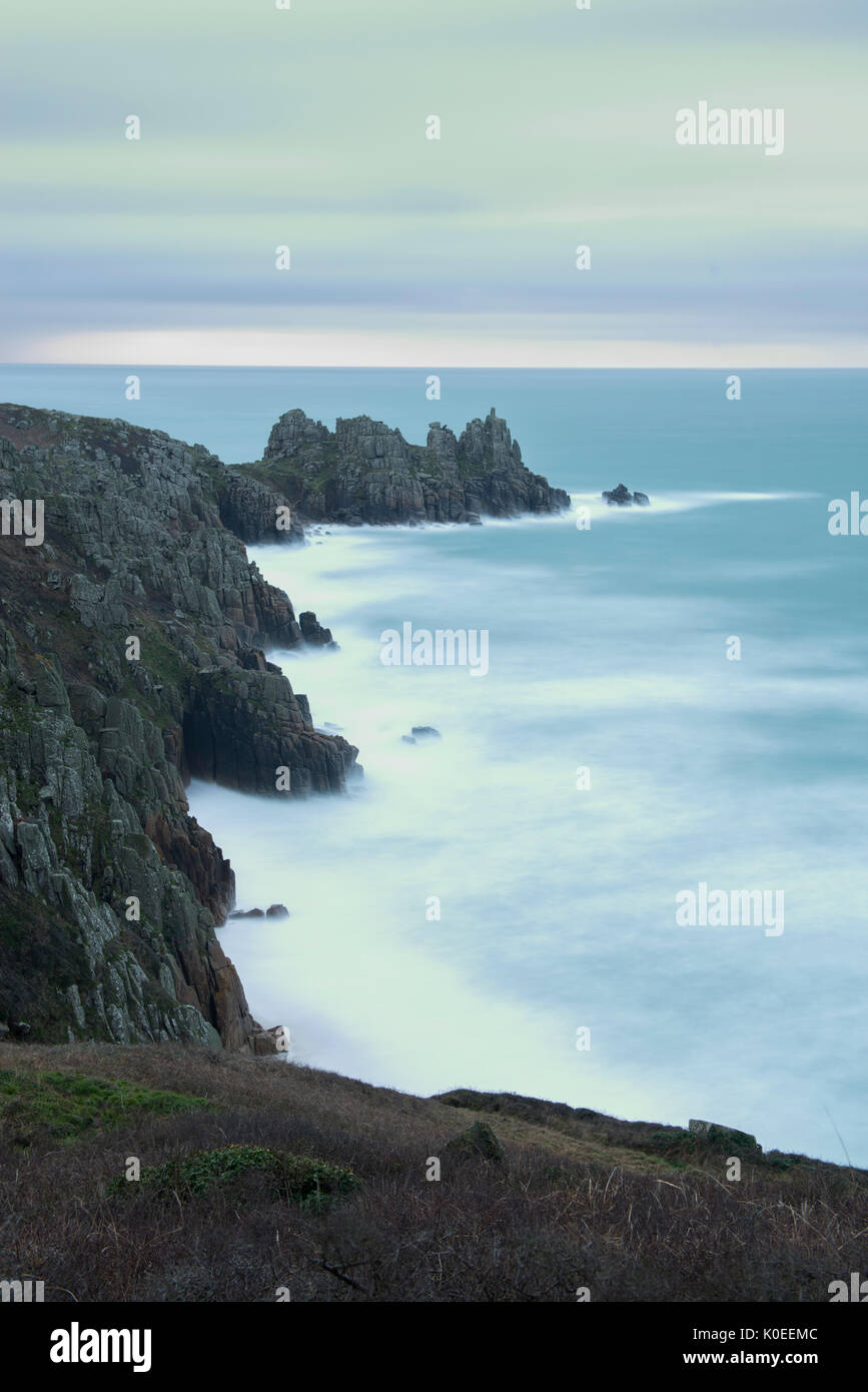 The view towards Logan Rock from Treen in West Cornwall. Stock Photo