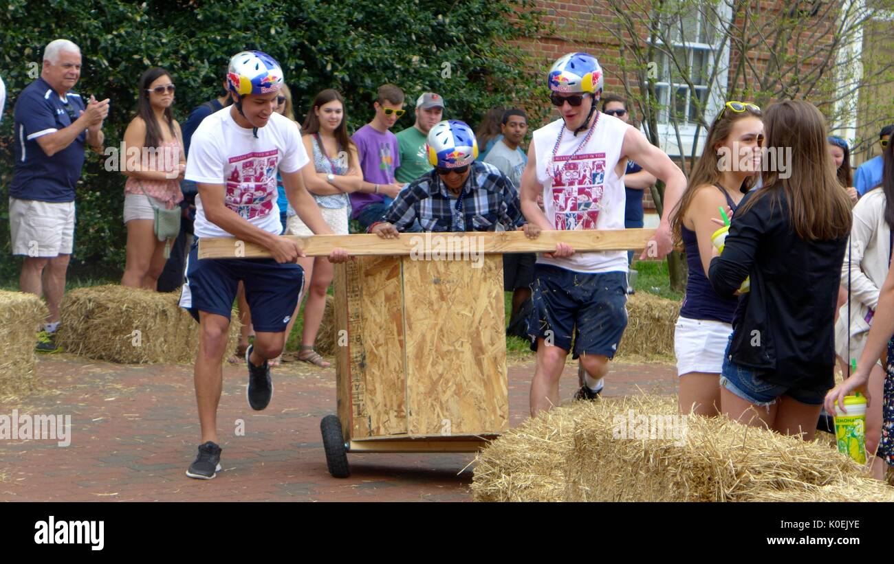 College students participate in the Red Bull chariot race during Spring Fair, an annual festival with music, food, shopping, and more that takes place every spring on the Homewood campus of the Johns Hopkins University in Baltimore, Maryland. 2014. Courtesy Eric Chen. Stock Photo