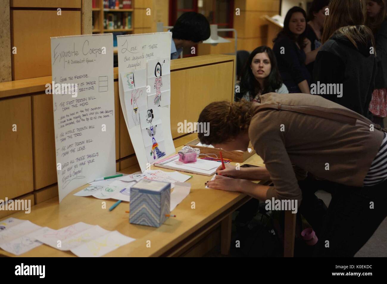 College students participate in an interactive activity on M-level (the main level) of the Milton S. Eisenhower Library on the Homewood campud of the Johns Hopkins University in Baltimore, Maryland, 2014. Courtesy Eric Chen. Stock Photo