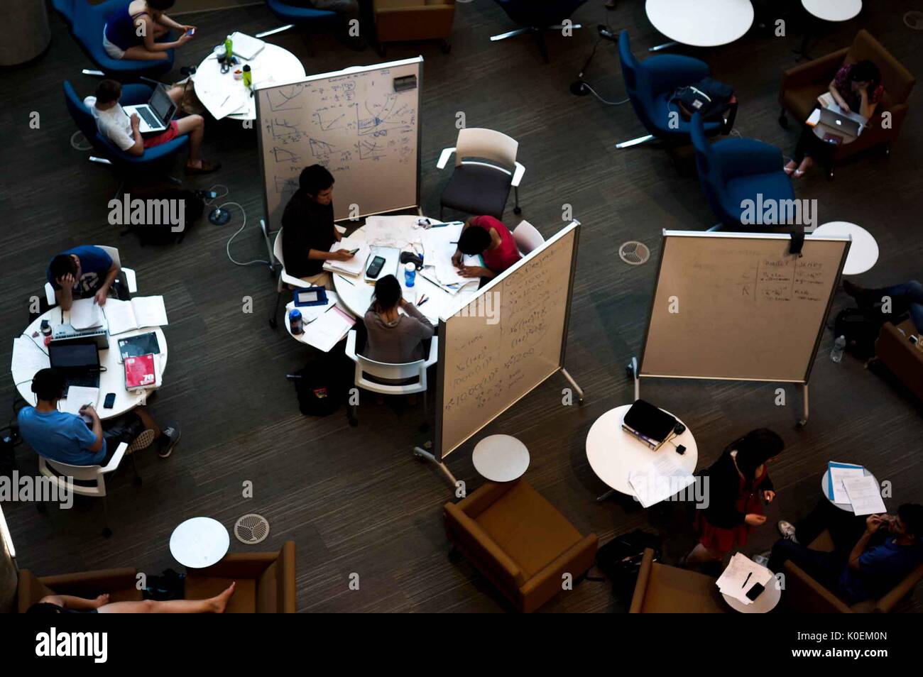 Bird's-eye view of round tables and portable white boards on the main floor of Brody Learning Commons, the college students are studying for finals, May, 2014. Courtesy Eric Chen. Stock Photo