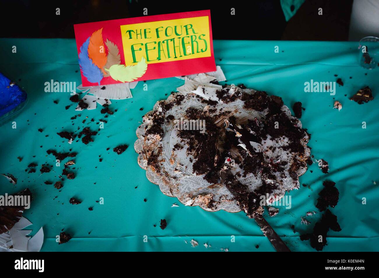 Only crumbs remain on a cake platter titled 'The Four Feathers' at the Edible Book Festival, April, 2014. Courtesy Eric Chen. Stock Photo