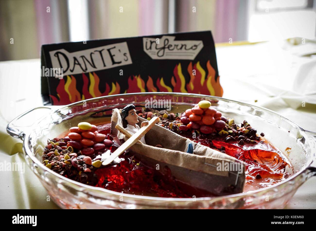 A partially-eaten Dante's Inferno dessert at the 2014 Edible Book Festival, a literary cake competition for students on the Homewood campus of the Johns Hopkins University in Baltimore, Maryland, 2014. Courtesy Eric Chen. Stock Photo